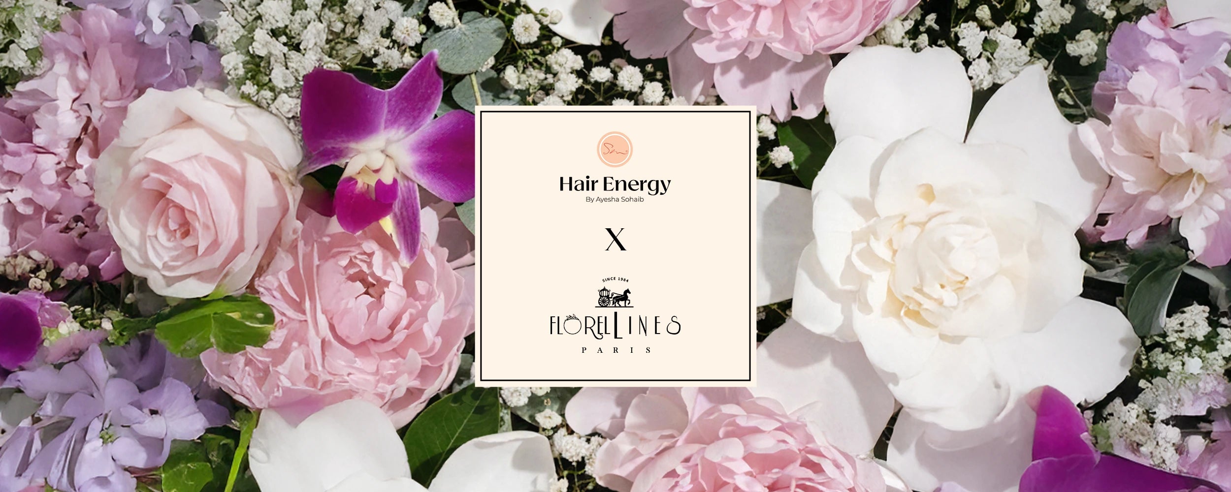Floral arrangement with a 'Hair Energy' product box in the center