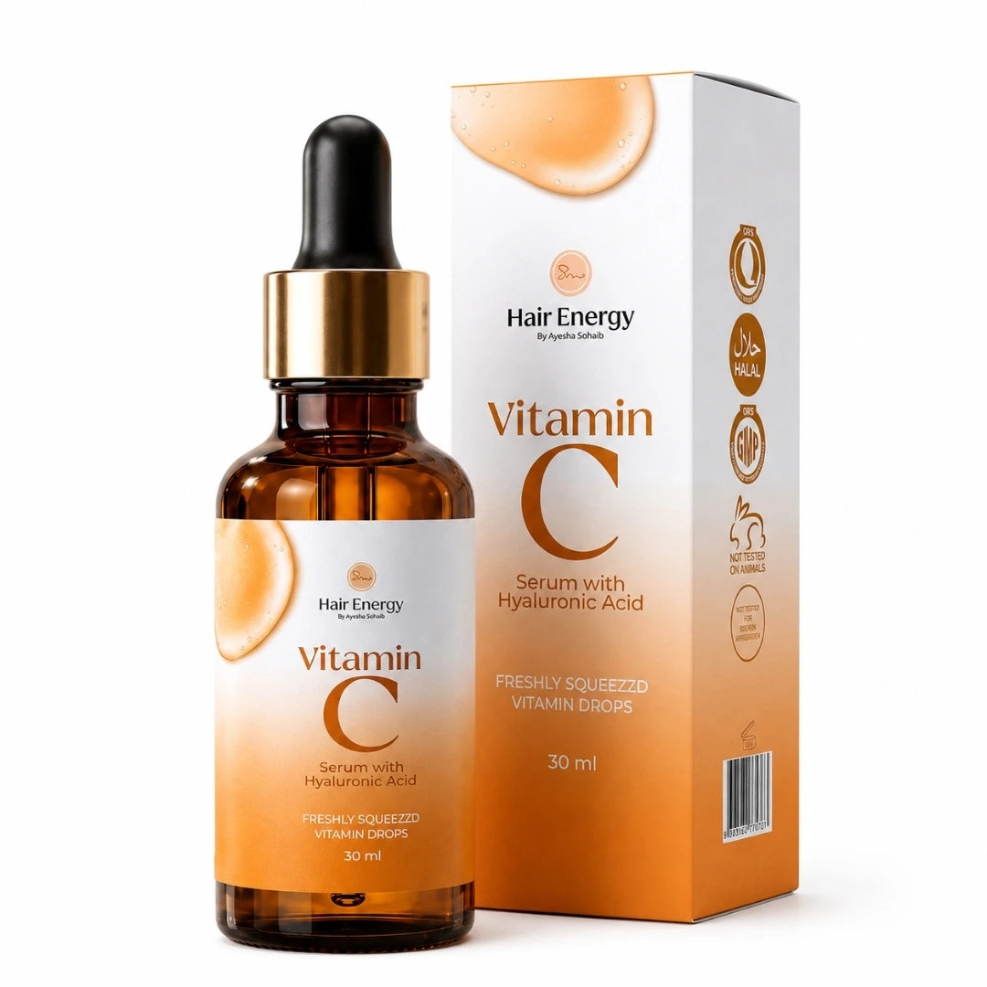Hair Energy Vitamin C Serum with Hyaluronic Acid in an amber glass dropper bottle next to its white and orange packaging box, on a clean white background.